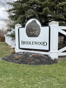 A community sign showing the name of Evergreen community within Calgary, Alberta, in the southwest side of Calgary.